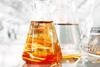 Conical flask with orange liquid image