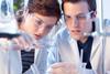 Scientists observing a chemical reaction