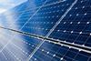 A picture showing solar panels with blue sky and white colours top left corner to illustrate an article about fuelling the future with hydrogen, solar and wind power