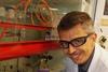 Boris is in the laboratory, smiling at the camera. 