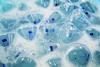 An image showing flasks in soapy water