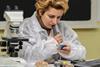 A photo of a geologist examining rock samples