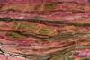 Pink, striated rhodonite mineral