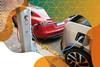 Photo of two electric cars plugged into a charging station