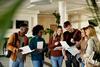 A group of students are looking at their qualifications.