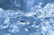 A photograph of bubbles in boiling water