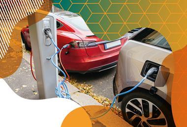 Photo of two electric cars plugged into a charging station