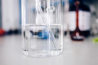 Measuring the temperature of a liquid to determine whether the reaction is exothermic or endothermic