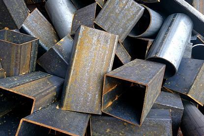 A pile of scrap iron with brown rust visible