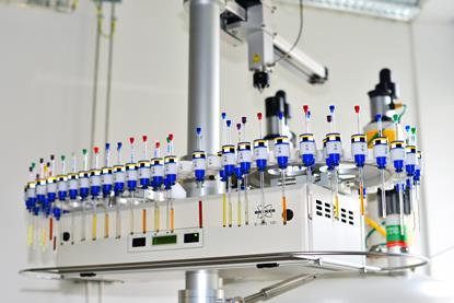 Autosampler of NMR spectrometer loaded with samples for analysis. Institute of Organic and Biochemistry Academy of Sciences the Czech Republic