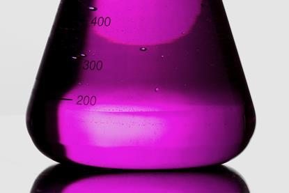 A close-up photograph of a conical flask containing a purple liquid