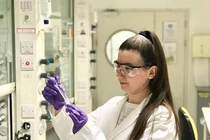 Erin Maciejewski working in a lab.