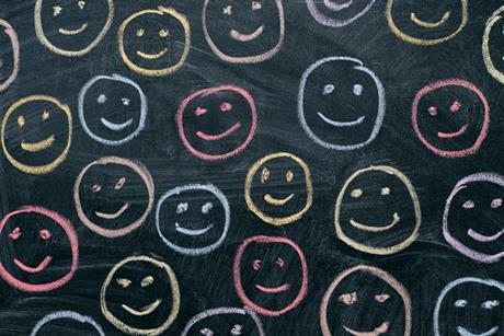 An image showing happy faces on a blackboard