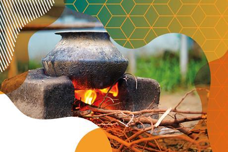 Photo of a traditional cooking stove that burns wood under a cooking pot