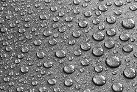 picture of drops of water on a teflon surface