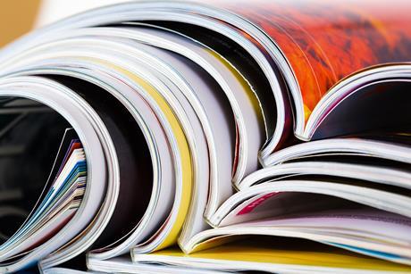 Closeup of a pile of magazines with bending pages