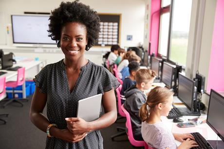 Female teacher in a computer room
