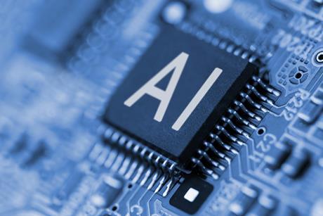 A close-up realistic image of a computer chip with the letters "AI" printed on it